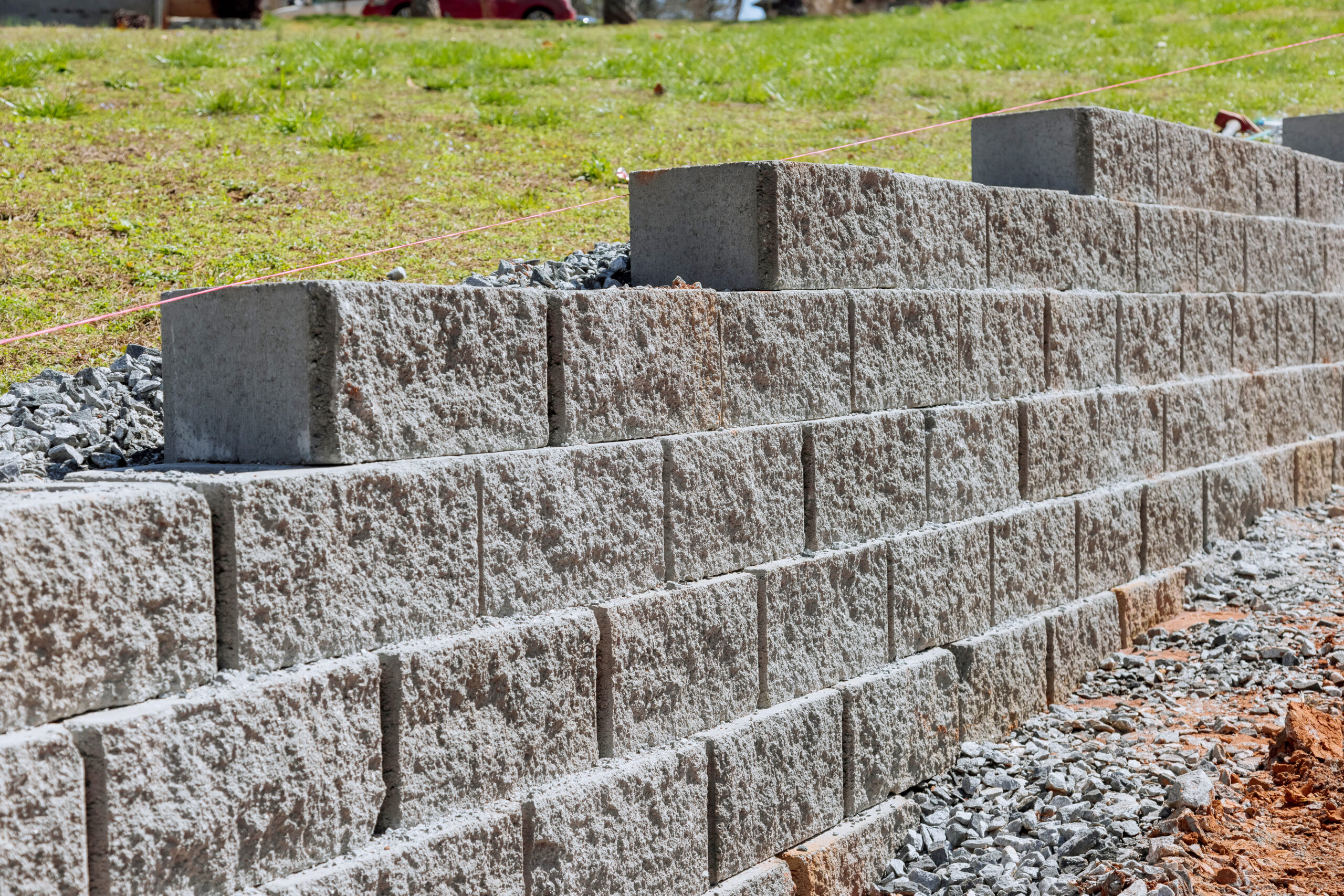A retaining wall is being built as part of construction of a new home near a property where the wall is to be built